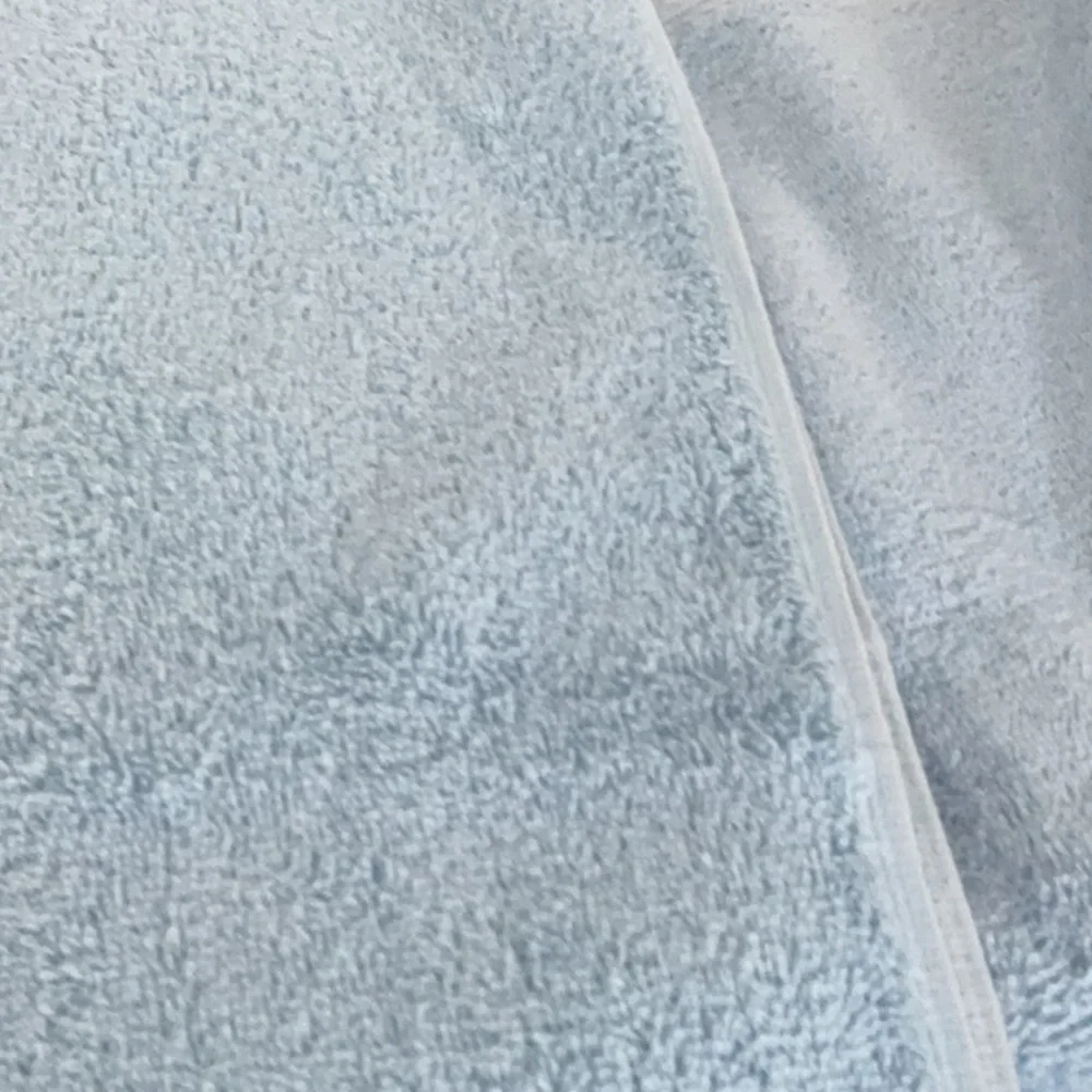 Martha Stewart set of 2 hygrocotton bath towels. Color is Angel Falls blue.